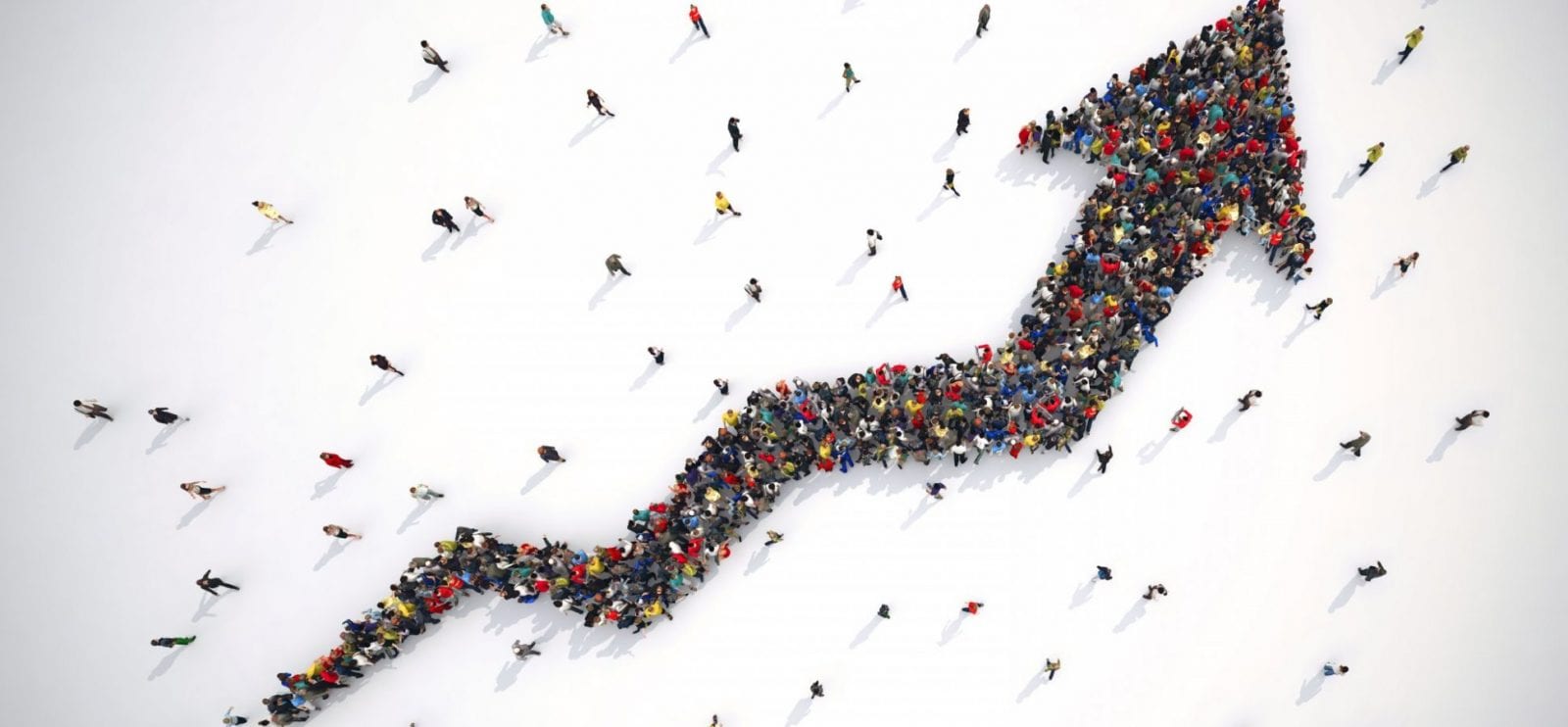 Numerous individuals are lined up, creating a clear arrow formation that directs attention ahead.