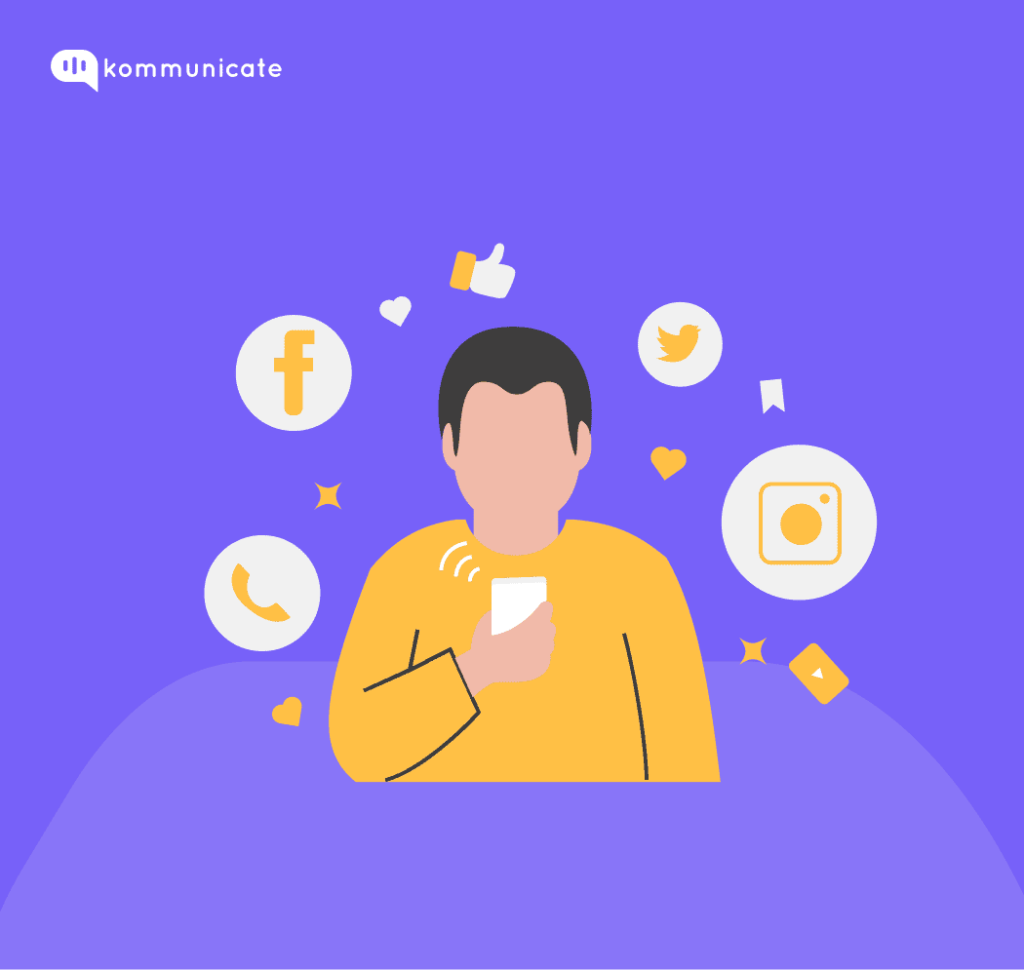 Illustration with the Kommunicate logo, featuring a person holding a smartphone surrounded by social media icons (Facebook, Twitter, Instagram), a phone icon, thumbs-up icons, and heart icons.