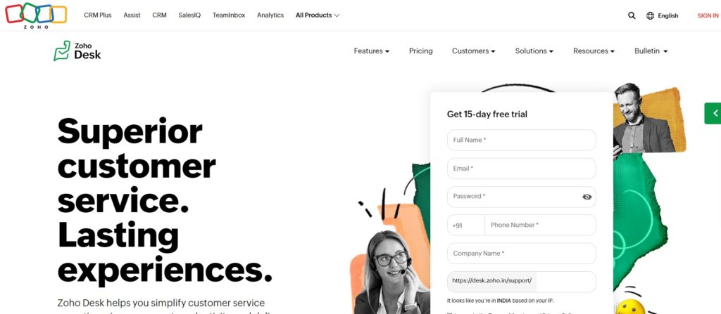 Zoho Desk homepage with a bright, colorful background featuring illustrations of customer service agents. The headline reads "Superior customer service. Zoho Desk homepage with a bright, colorful background featuring illustrations of customer service agents. The headline reads "Superior customer service.