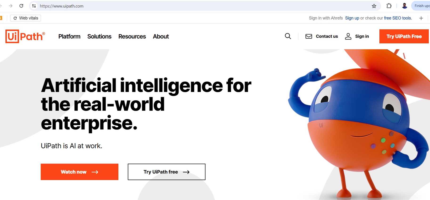 UiPath Website Homepage with a Robot Mascot UiPath homepage with a robot mascot, showcasing their AI-powered automation platform.