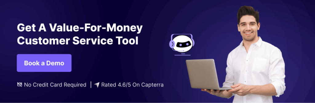 Book a Demo with Kommunicate - The Best Intercom Alternative! Smiling man holding a laptop with chatbot illustration and text promoting a value-for-money customer service tool. Includes call to action 'Book a Demo' and mentions no credit card required, rated 4.6/5 on Capterra. Ideal for those seeking Intercom alternatives.