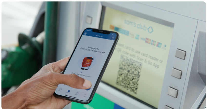 Sam's Club customer uses Scan & Go app at a Springdale, AR gas pump. Person using Sam's Club Scan & Go app on phone at gas pump, screen shows app and pump screen with QR code and card reader options.