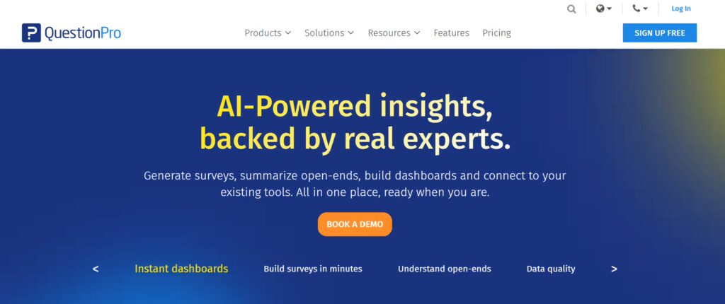 QuestionPro homepage with the headline 'AI-Powered insights, backed by real experts' on a deep blue gradient background, with a subheading describing survey generation, open-end summarization, dashboard building, and tool integrations, plus a Book a Demo CTA.